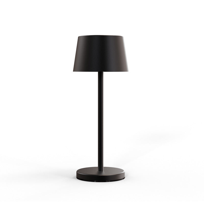 Lámpara de mesa Iris LED recargable, con la luz encendida