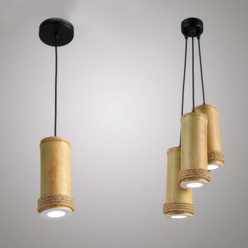 Lámpara colgante Palma de bambú y cordel, encendida creando luz cálida