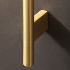 Aplique de pared Estela de cobre y cristal, en un ambiente residencial acogedor